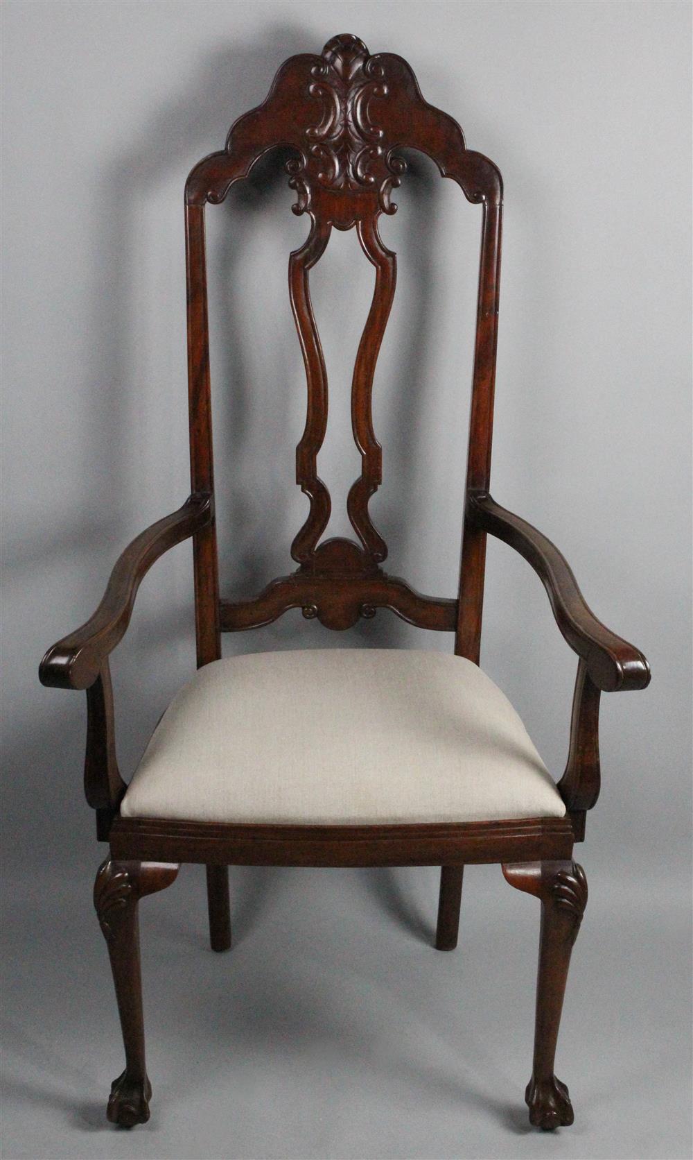 Appraisal: DUTCH COLONIAL STYLE CARVED MAHOGANY ARM CHAIR having an arching