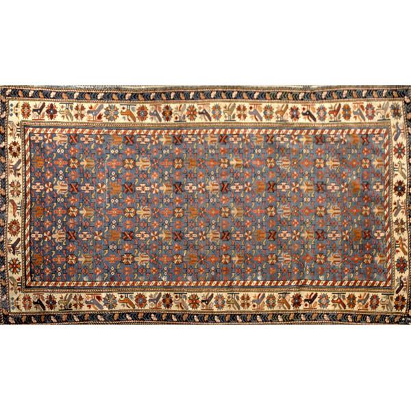 Appraisal: CAUCASIAN Oriental carpet with floral design on dark blue ground