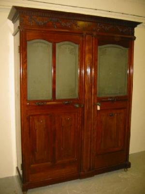 Appraisal: A VICTORIAN MAHOGANY WARDROBE the dentil moulded cornice over deep