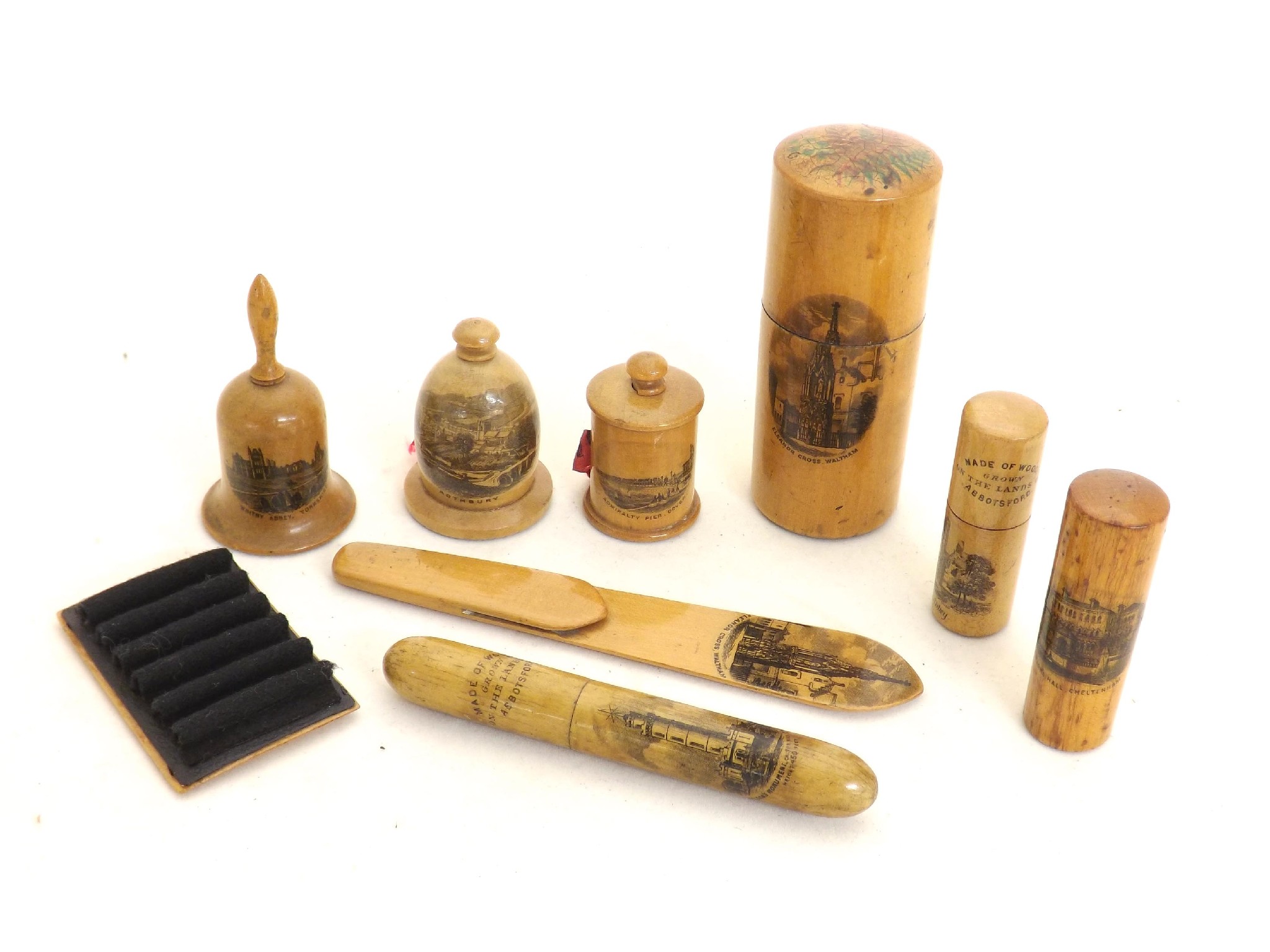 Appraisal: Mauchline ware - tape measures together with needle holders a