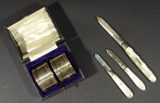 Appraisal: Three silver bladed mother of pearl fruit knives and a