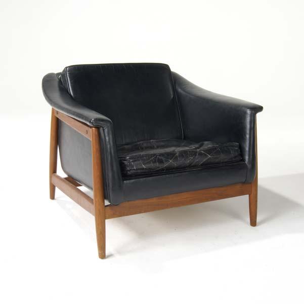 Appraisal: DUX Scandivian Lounge chair upholstered in black leather on teak