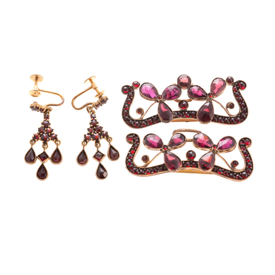 Appraisal: A Pair of Garnet Buckle Brooches Earrings K yellow gold