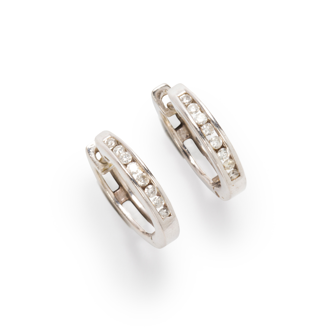 Appraisal: A PAIR OF DIAMOND AND FOURTEEN KARAT WHITE GOLD EARRINGS