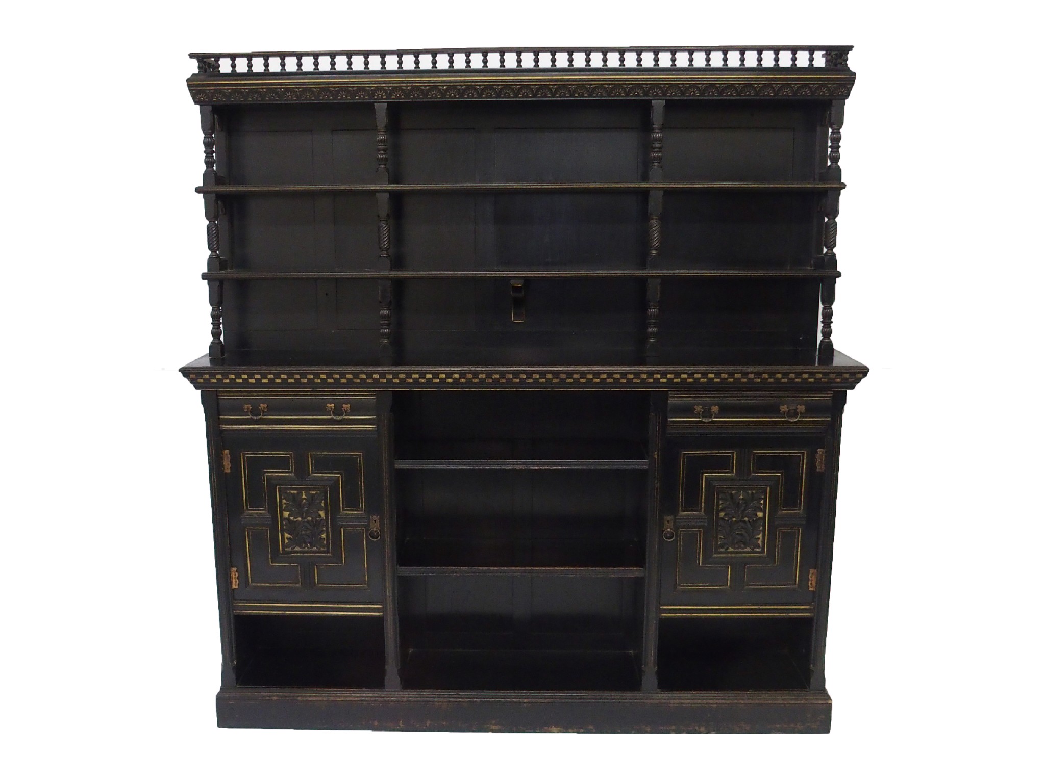 Appraisal: An Aesthetic movement ebonised and gilt open bookcasethe baluster turned