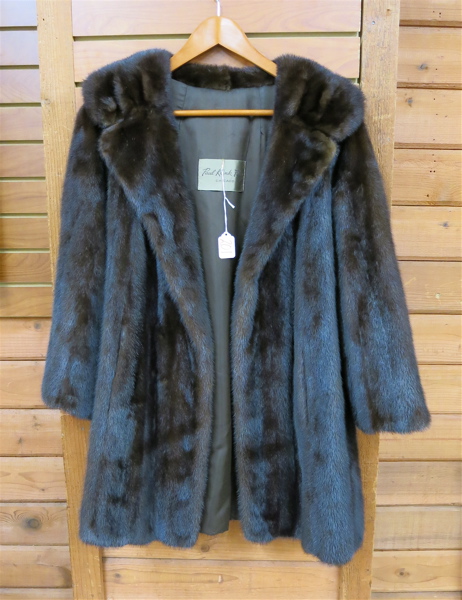 Appraisal: LADY'S MINK COAT having dark brown fur two exterior and