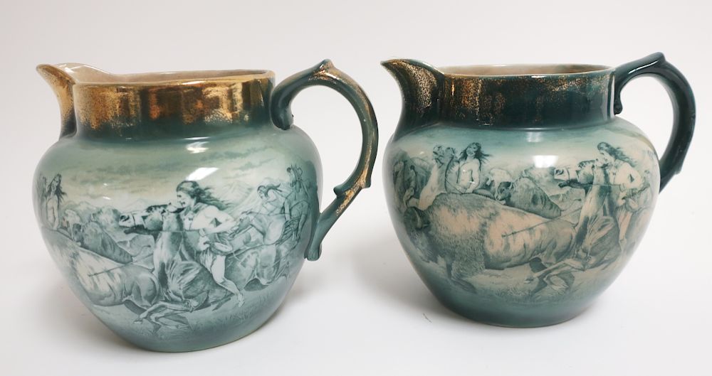 Appraisal: Buffalo Pottery Pitchers Indian hunting Buffalo Buffalo Pottery Pitchers Indian