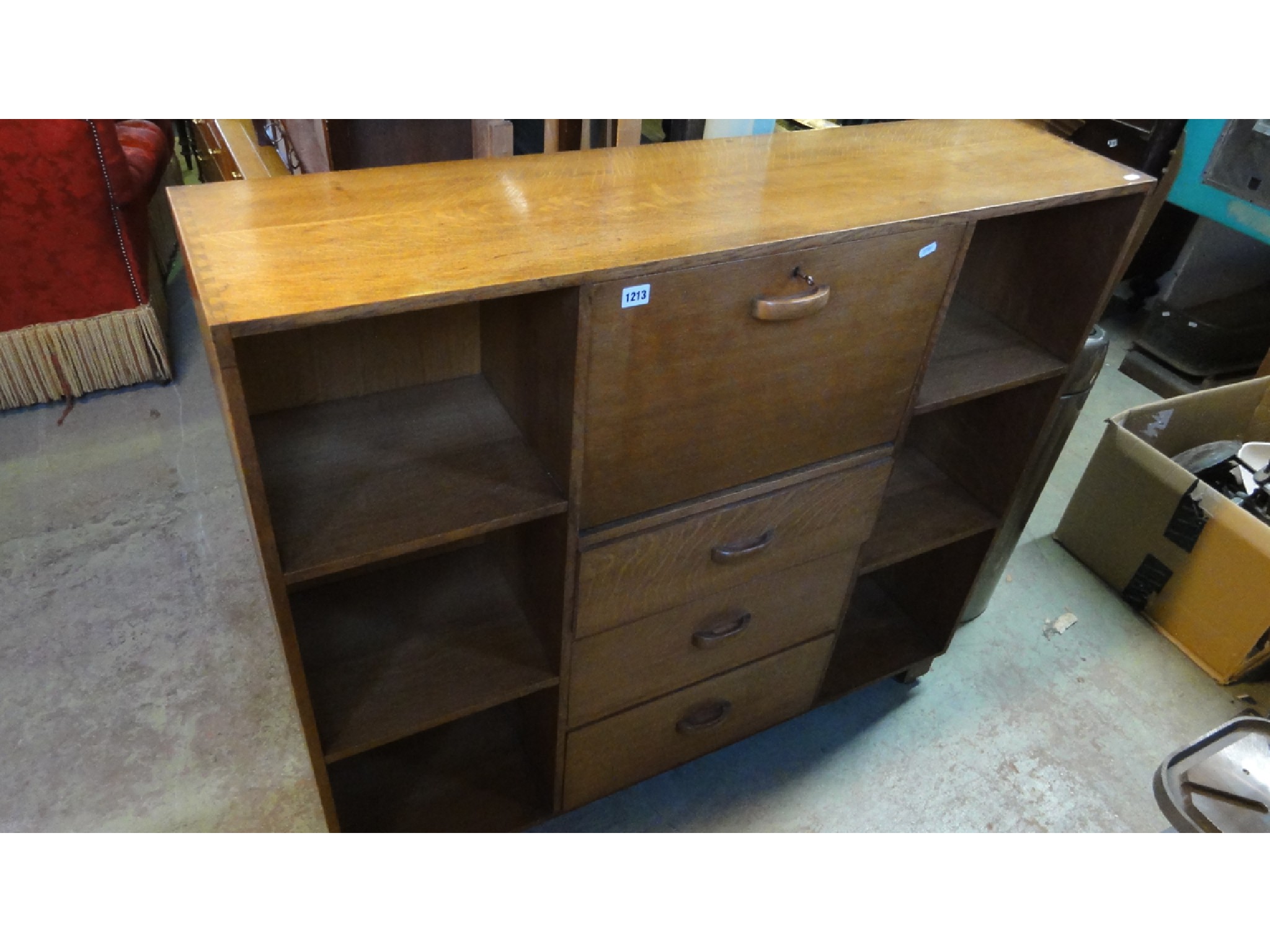 Appraisal: A slim free standing medium to light oak bureau bookcase