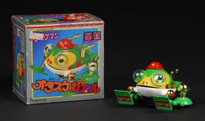 Appraisal: Otasuke Kaer Die-Cast Frog From Otasukeman Description Japanese Made by