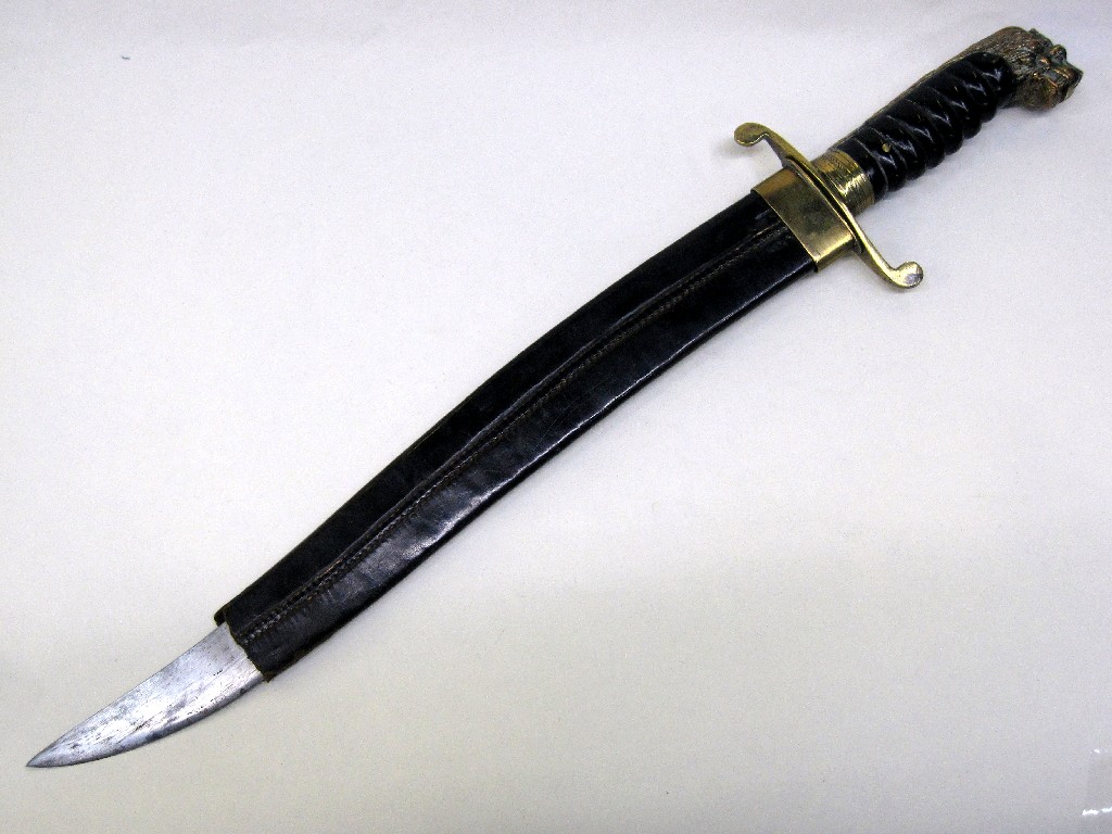 Appraisal: Large knife with lion's head terminal in sheath