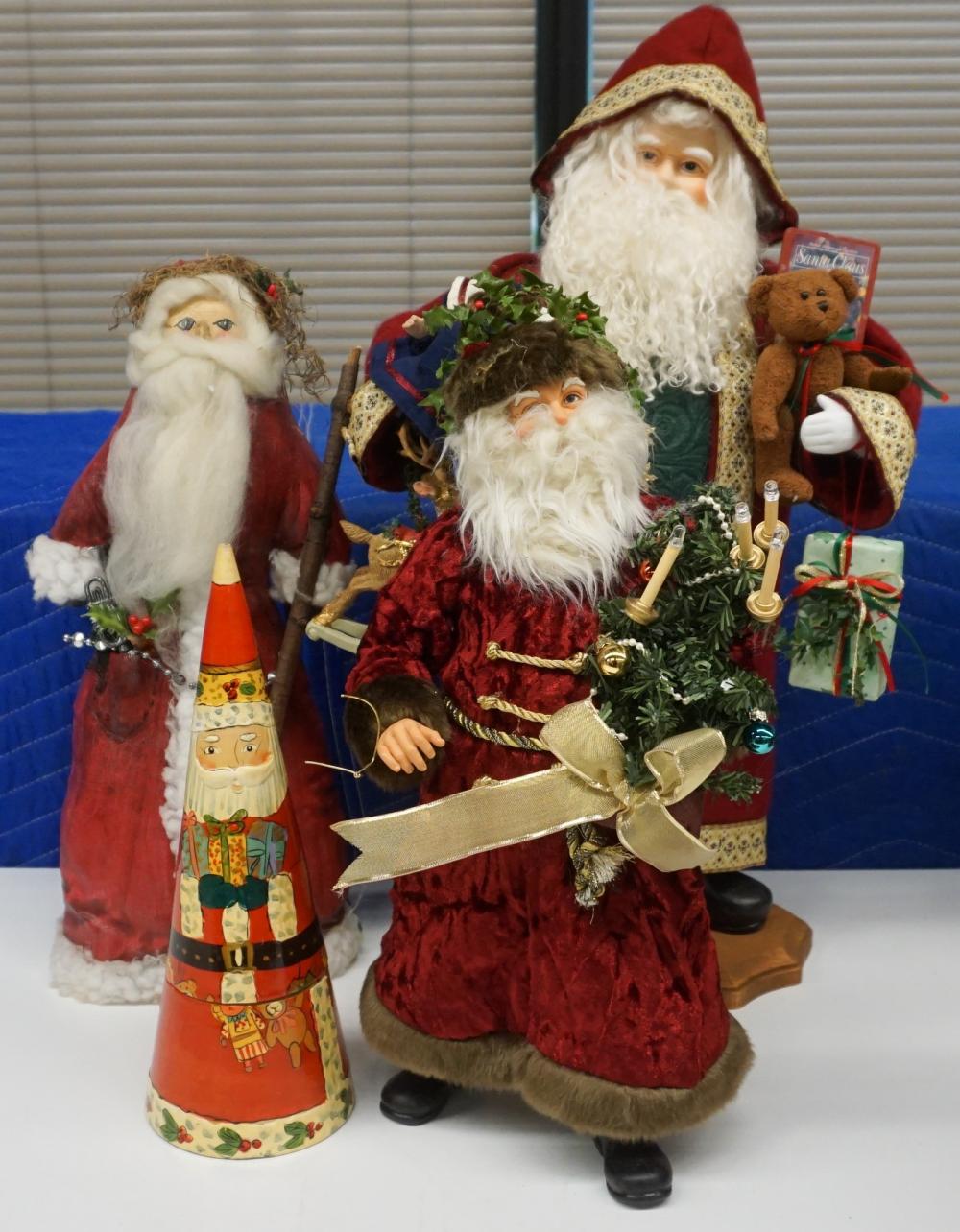 Appraisal: Group of Four Figures of Santa Claus