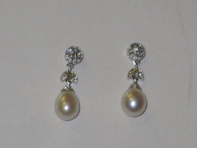 Appraisal: A PAIR OF PEARL AND DIAMOND EARRINGS having pearl pear