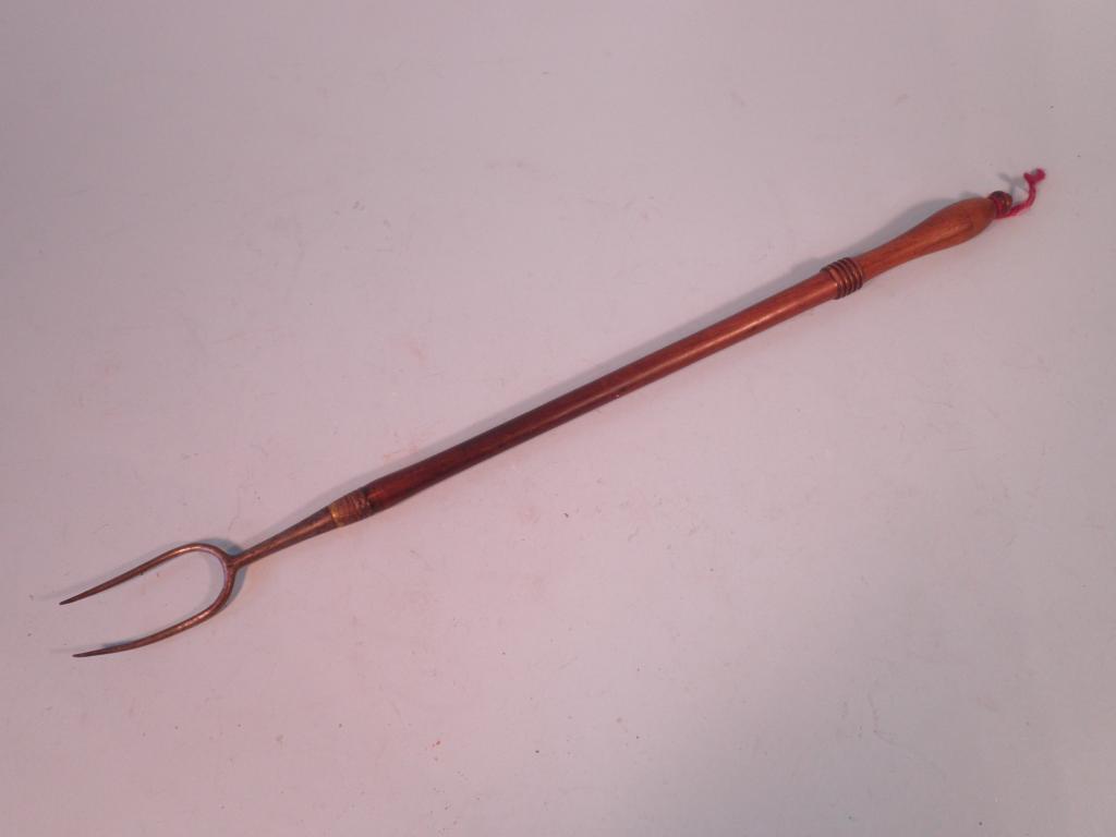 Appraisal: An early thC turned fruit wood and steel toasting fork