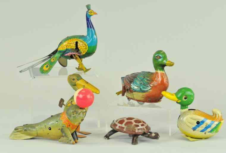 Appraisal: TIN TOY ANIMAL GROUPING Amusing tin toy lot includes Peacock