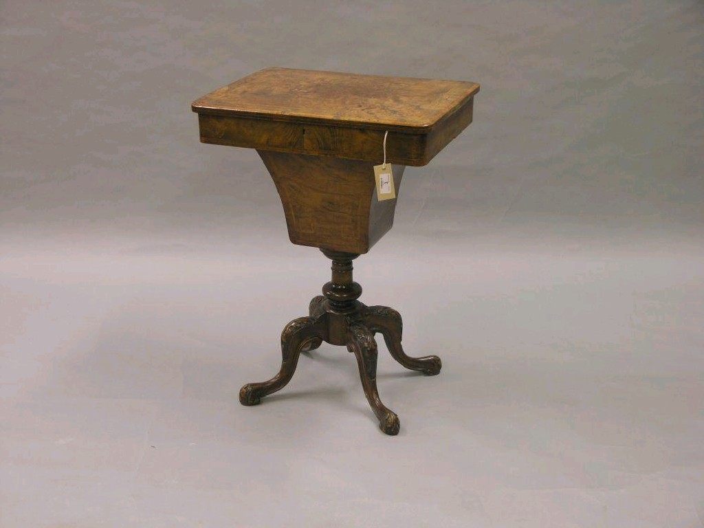 Appraisal: A Victorian burr walnut work table hinged top with tulip