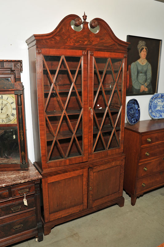 Appraisal: TWO PIECE CHINA CABINET Mahogany and mahogany veneer having a