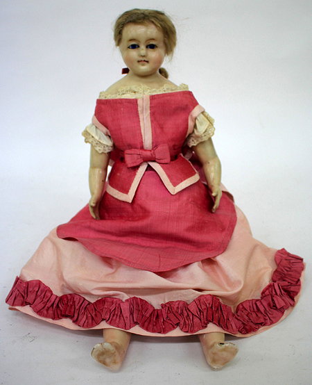 Appraisal: A VICTORIAN WAX OVER HEADED DOLL with pink satin dress