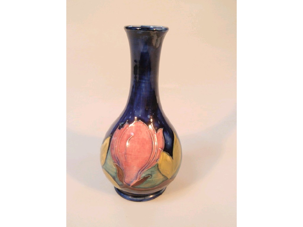 Appraisal: A Moorcroft pottery bottle vase tube lined and painted with