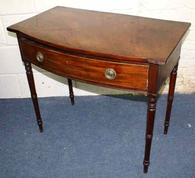 Appraisal: A VICTORIAN MAHOGANY BOW FRONTED SIDE TABLE with single drawer