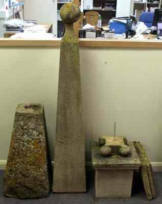 Appraisal: A stone obelisk modern on four ball feet and square