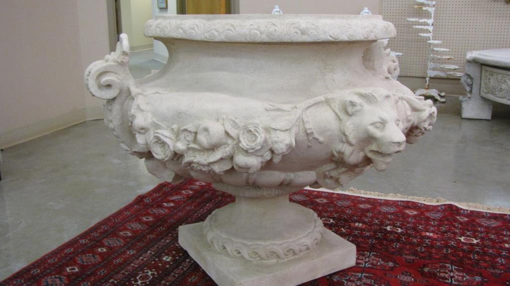 Appraisal: A decorator-quality indoor composite urn with lion head motif and