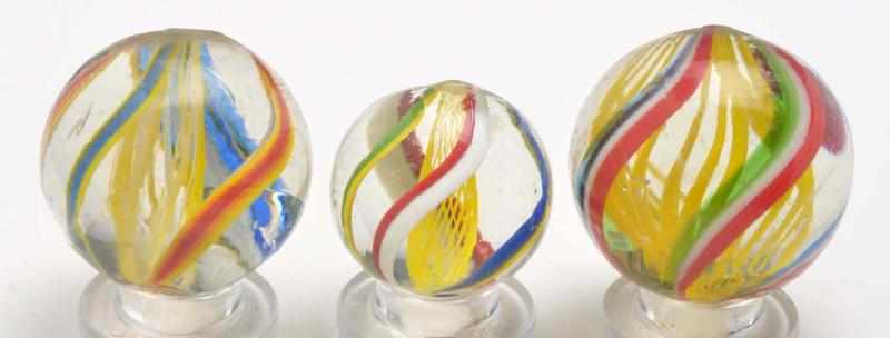 Appraisal: Lot of Bright Yellow Latticino Swirl Marbles Description All with