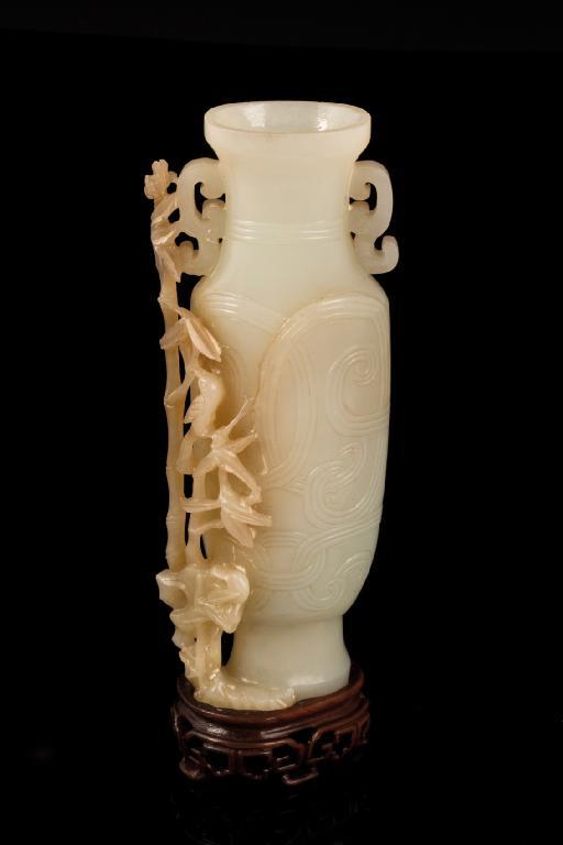 Appraisal: A CHINESE WHITE JADE VASE the flattened baluster body carved