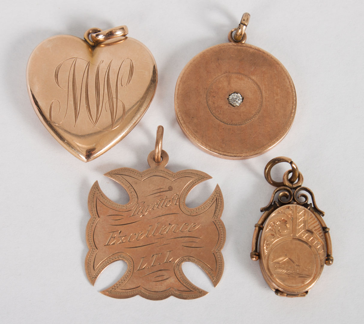 Appraisal: Four Victorian gold pendants comprising K gold round locket with