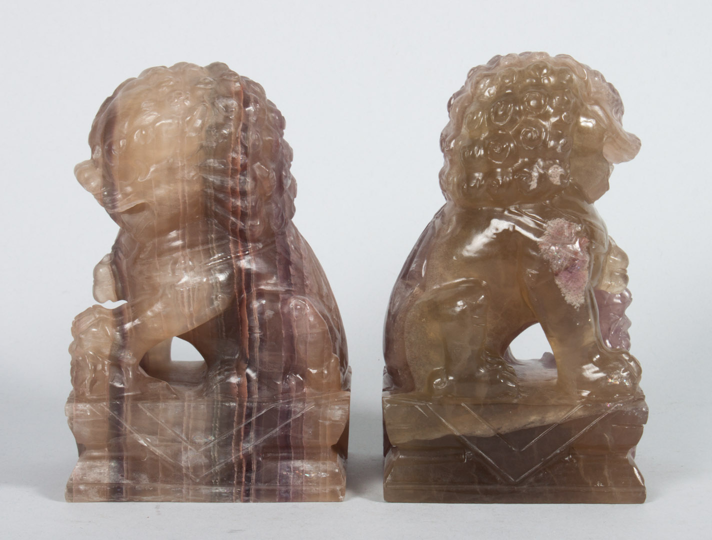 Appraisal: Two Chinese carved quartz foo dogs early th century each