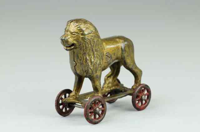 Appraisal: LION ON WHEELS STILL BANK A C Williams cast iron