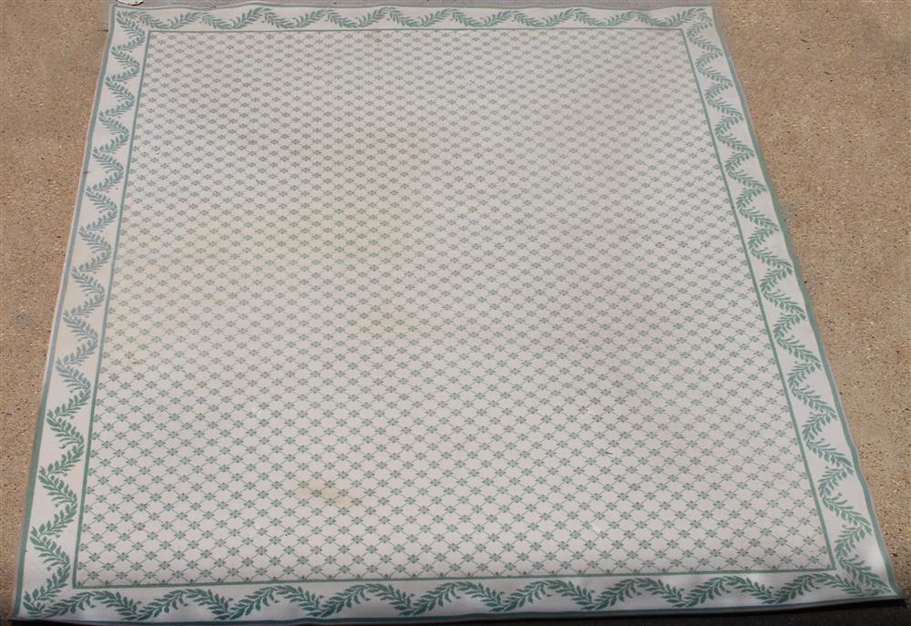 Appraisal: NEEDLEPOINT STYLE WOOL RUG machine made off-white with green trellis