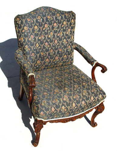 Appraisal: CARVED MAHOGANY OPEN ARM CHAIR Carved legs and arms Upholstered