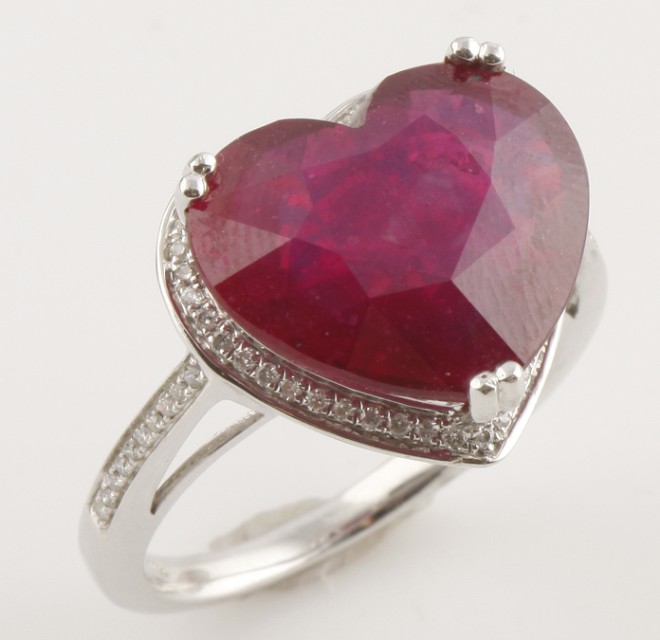 Appraisal: KW one heart shaped glass filled ruby approximately cts color