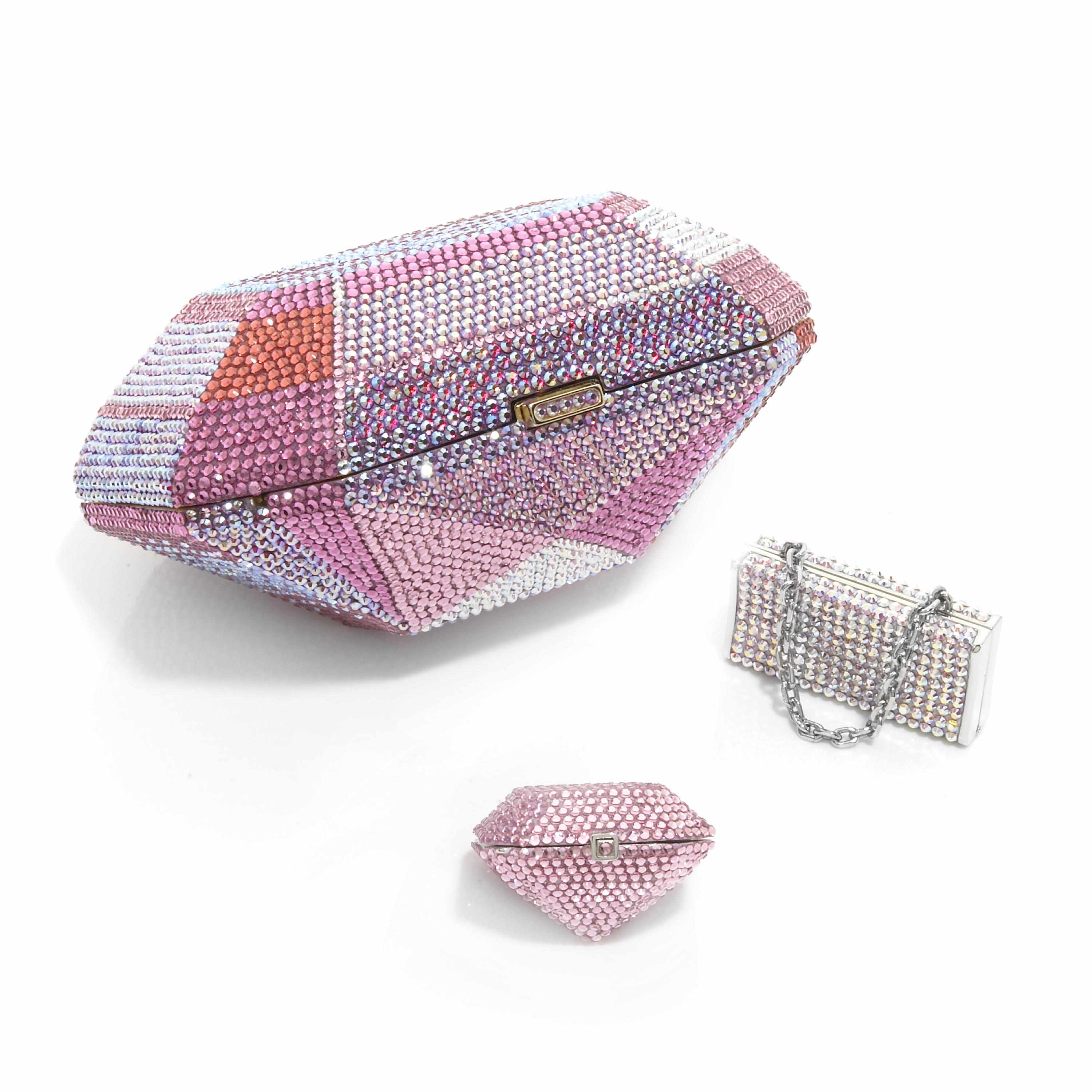 Appraisal: A pink crystal geometric diamond-shaped minaudiere together with two pink