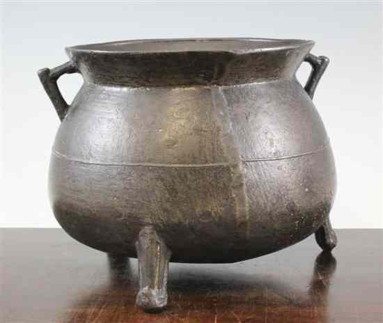 Appraisal: A bronze double handled cauldron th century of bulbous form