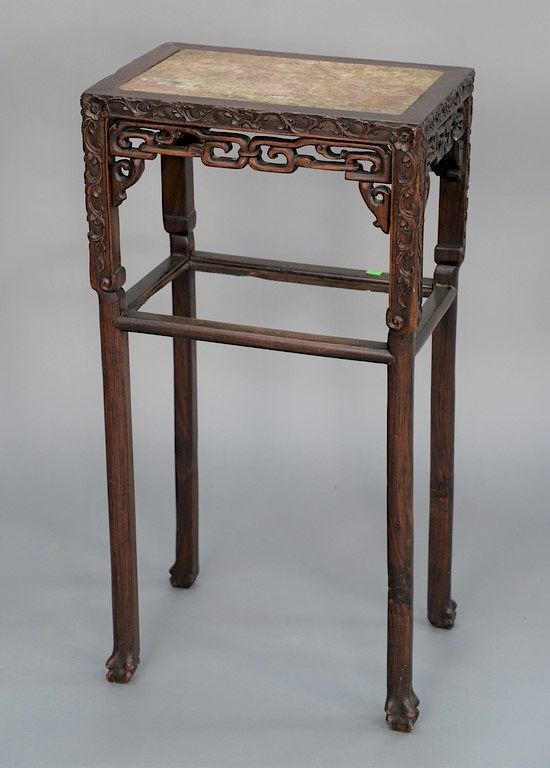 Appraisal: Chinese th century hardwood stand with marble top over carved