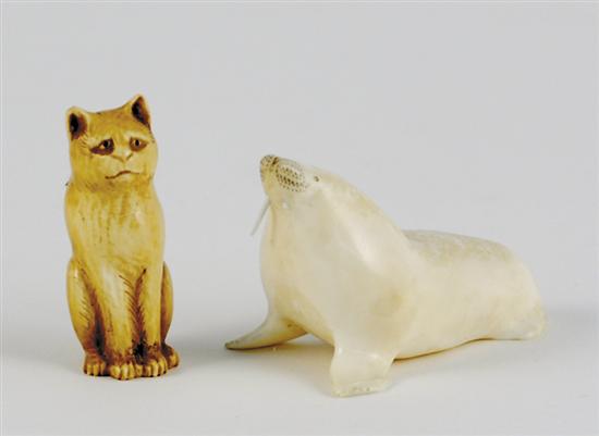 Appraisal: Carved ivory miniature figure and netsuke walrus H L cat-form