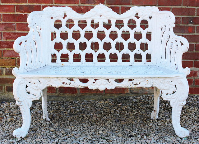 Appraisal: A WHITE PAINTED CAST IRON GARDEN SEAT OR BENCH with