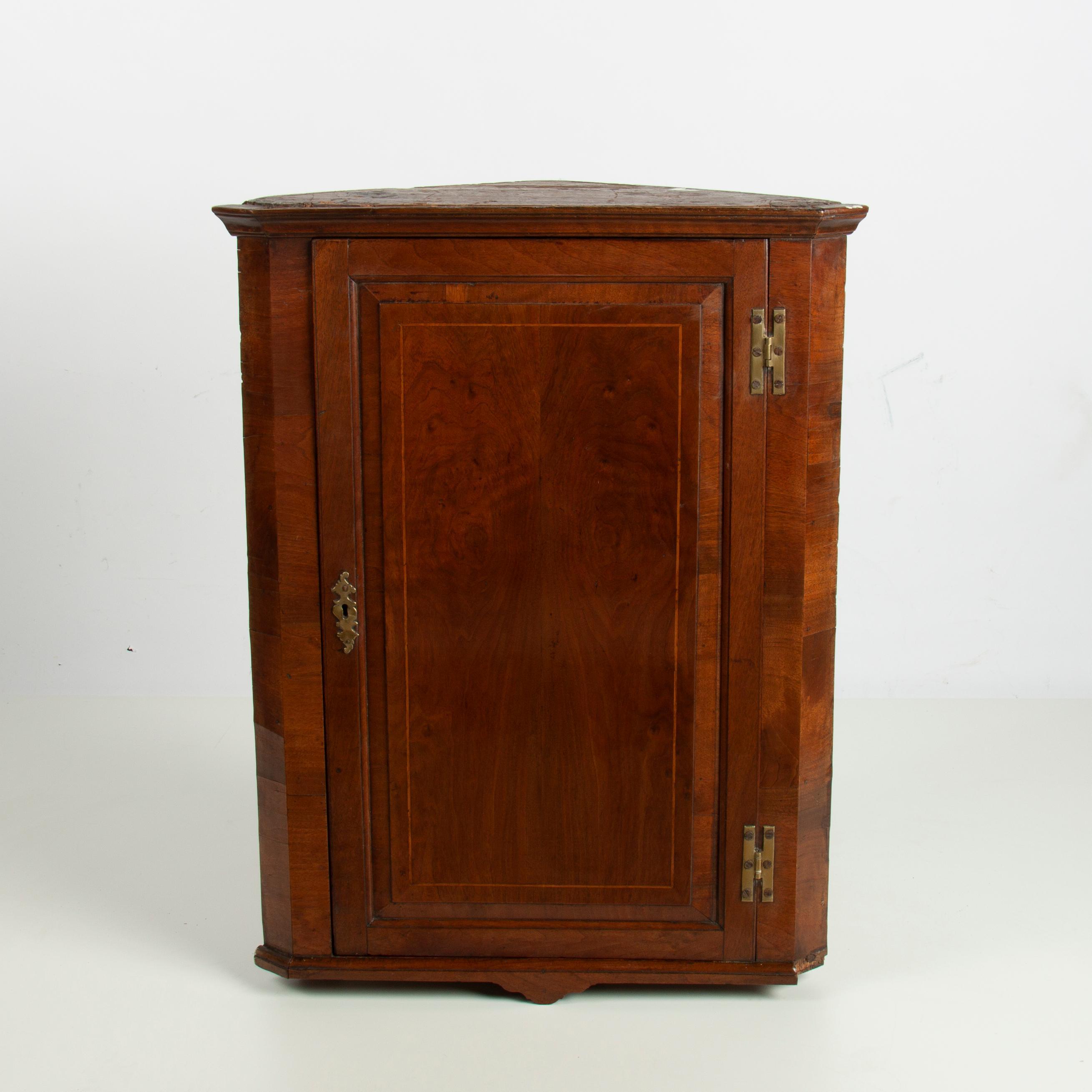 Appraisal: EARLY AMERICAN WALNUT HANGING CORNER WALL CABINET A hanging corner