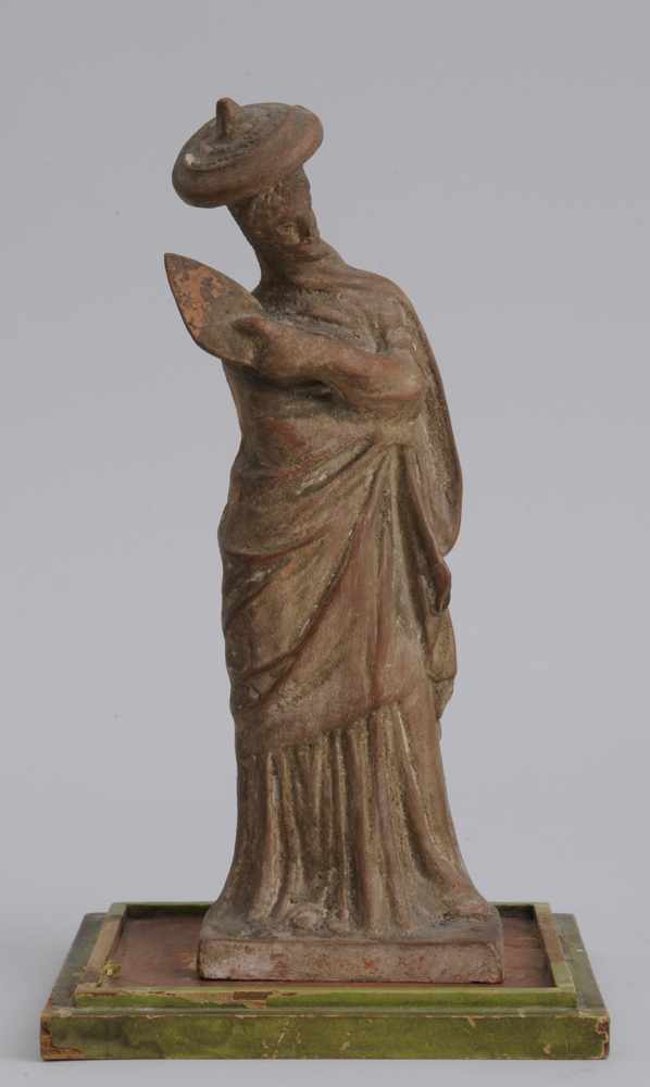 Appraisal: ROMAN STYLE POTTERY FIGURE OF A FEMALE MOURNER Modeled wearing