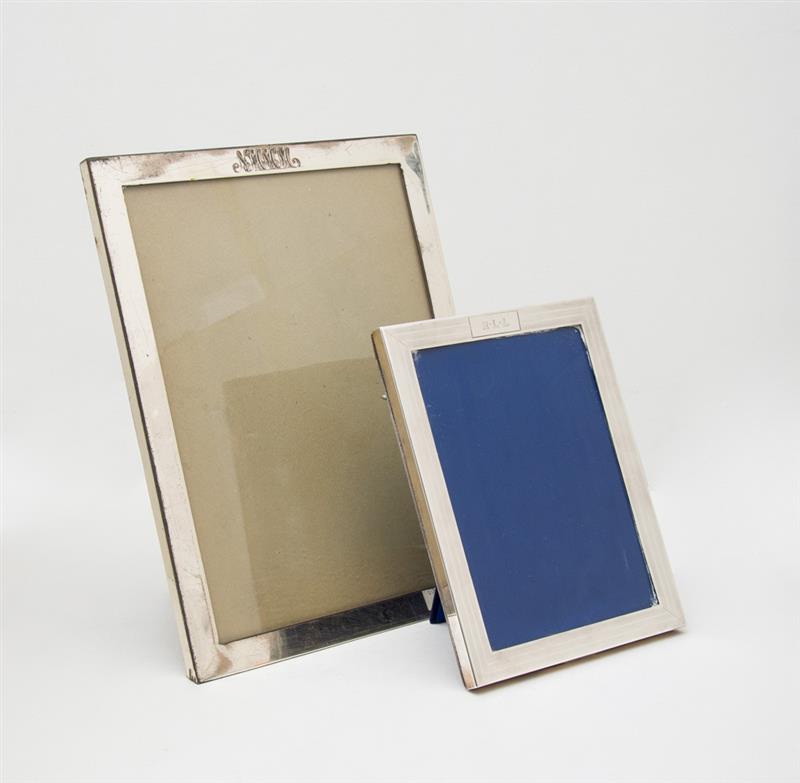 Appraisal: TWO LEBKUECHER CO MONOGRAMMED SILVER RECTANGULAR PICTURE FRAMES The smaller