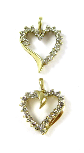 Appraisal: TWO DIAMOND AND TEN KARAT GOLD PENDANTS both yellow gold