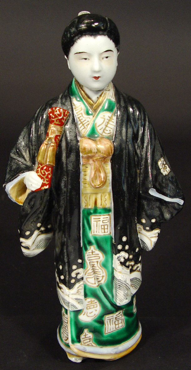 Appraisal: Japanese porcelain figurine of a geisha girl in hand enamelled