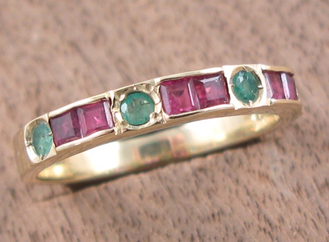 Appraisal: RUBY EMERALD AND FOURTEEN KARAT GOLD RING set with four