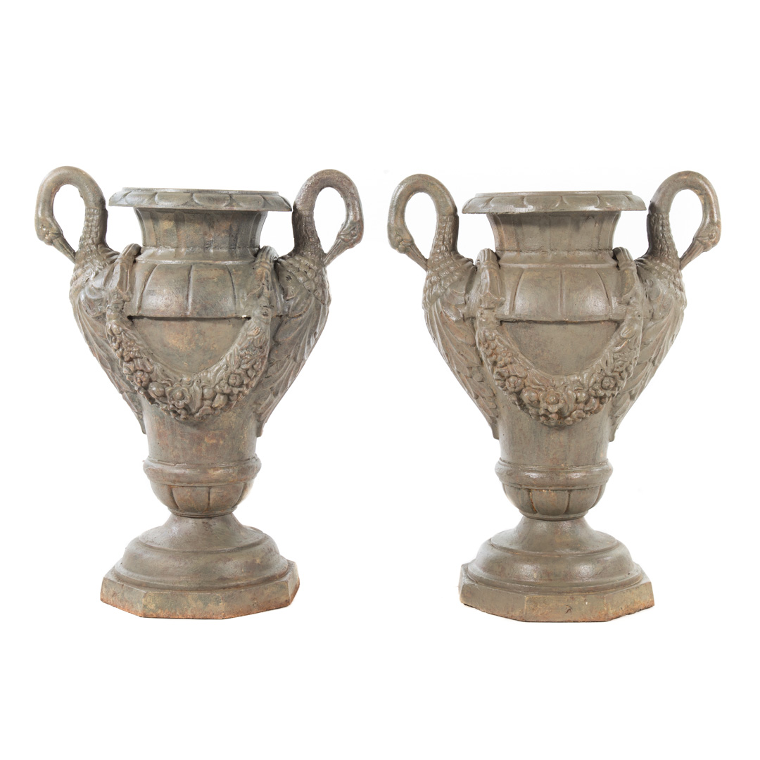 Appraisal: Pair classical style cast iron garden urns with swan-form handles