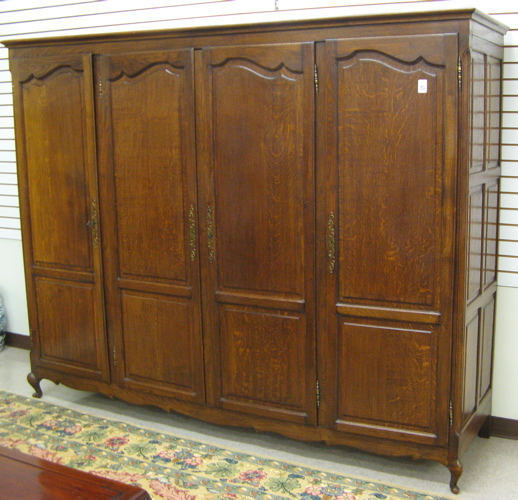 Appraisal: LOUIS XV STYLE FOUR-DOOR OAK ARMOIRE French c the front