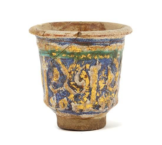 Appraisal: An Islamic Blue Green and Iridescent Gold Glazed Pottery Cup