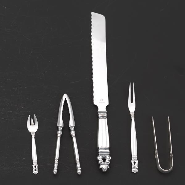 Appraisal: FIVE GEORG JENSEN FLATWARE PIECES Including serrated bread knife with