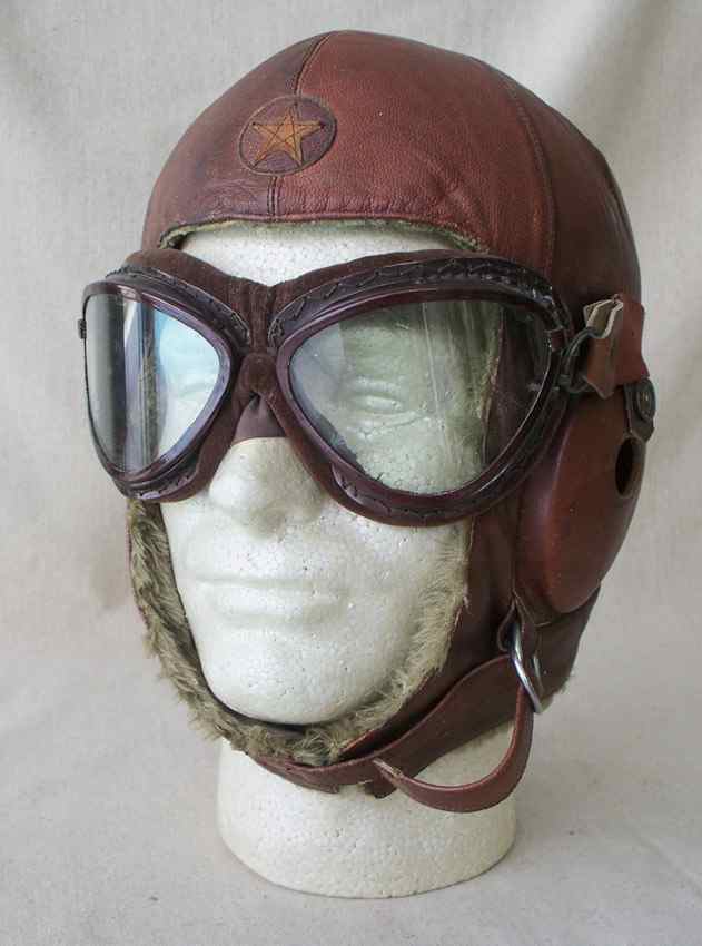 Appraisal: JAPANESE LEATHER BOMBER FLIGHT HELMET Heavy padding on crown The