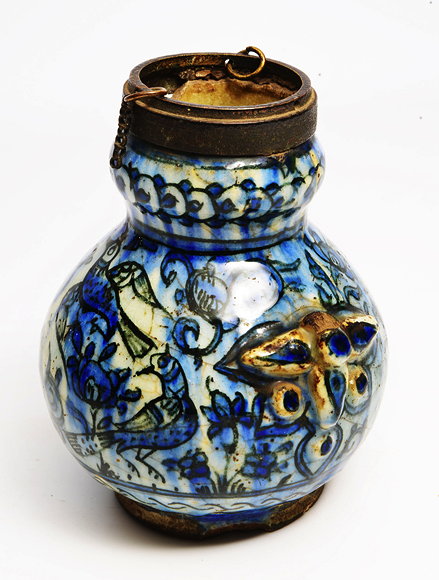 Appraisal: AN ANTIQUE ISLAMIC BLUE GLAZED POTTERY VASE decorated with birds